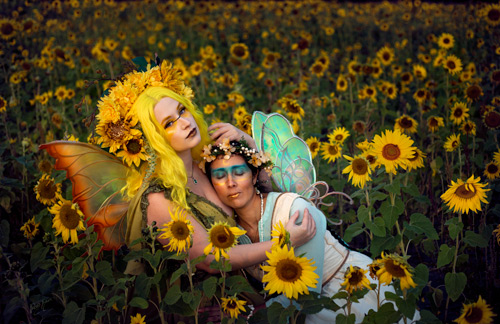 Fae sisters embracing in sunflowers - Kansas City fantasy photography